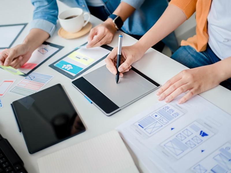 Colleagues planning work tasks.  Colleagues planning work tasks.