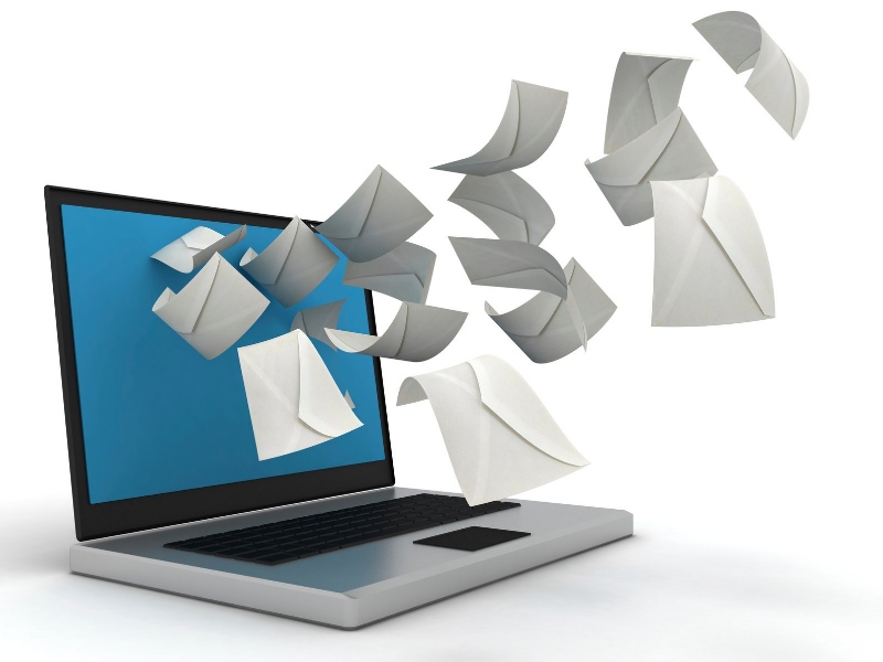 Illustration of emailed messages: envelopes being propelled from a laptop screen.