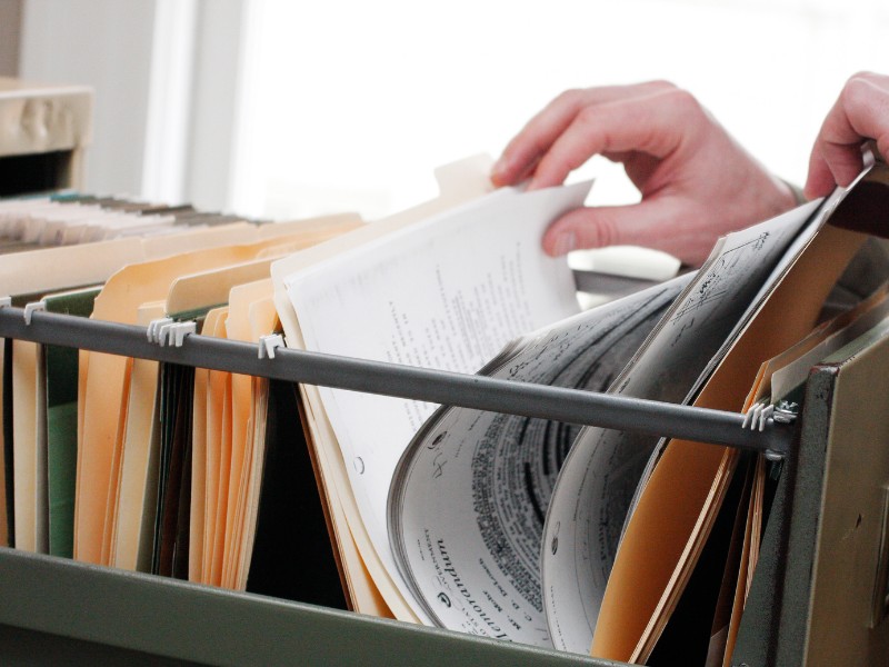 Filing cabinet to organize paper documents.
