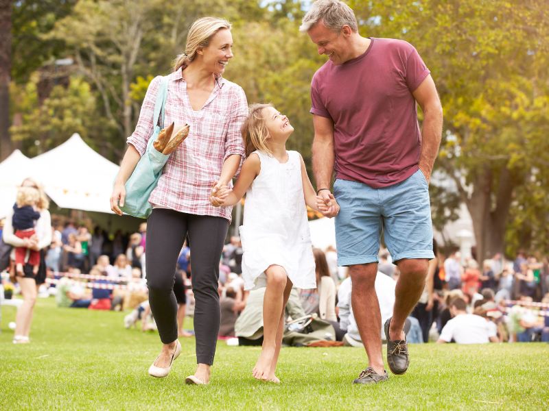 A family attending a fun fair event.