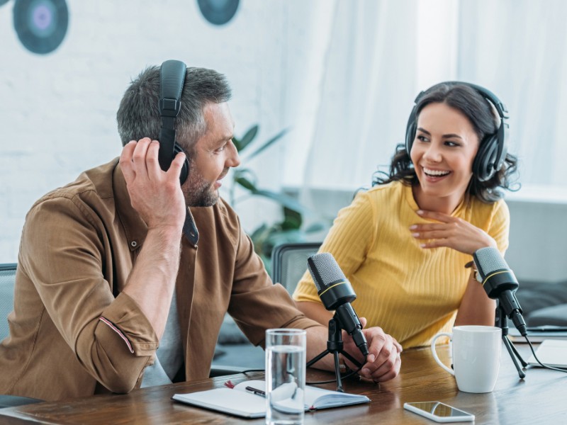 Two speakers doing a motivational podcast. Two speakers doing a motivational podcast.