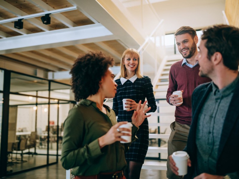 Four work colleagues having a coffee break.